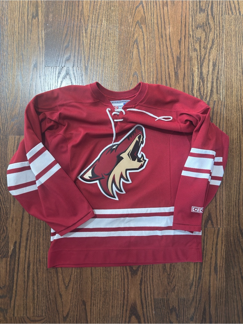 CCM Red Youth Hockey Jersey with Howling Coyote Chest Logo